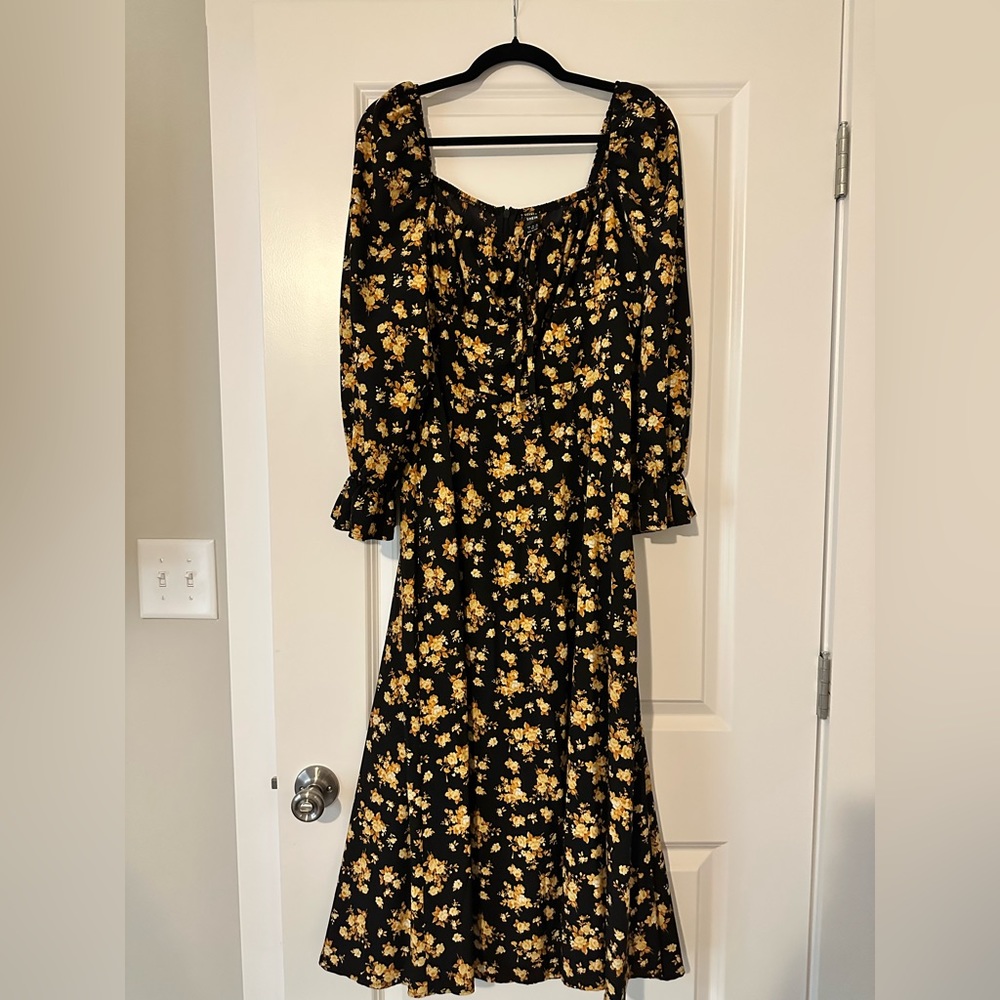 COPY - Black maxi dress with yellow flower detail.